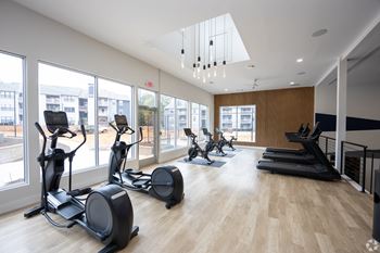 Extensive weight room with treadmill